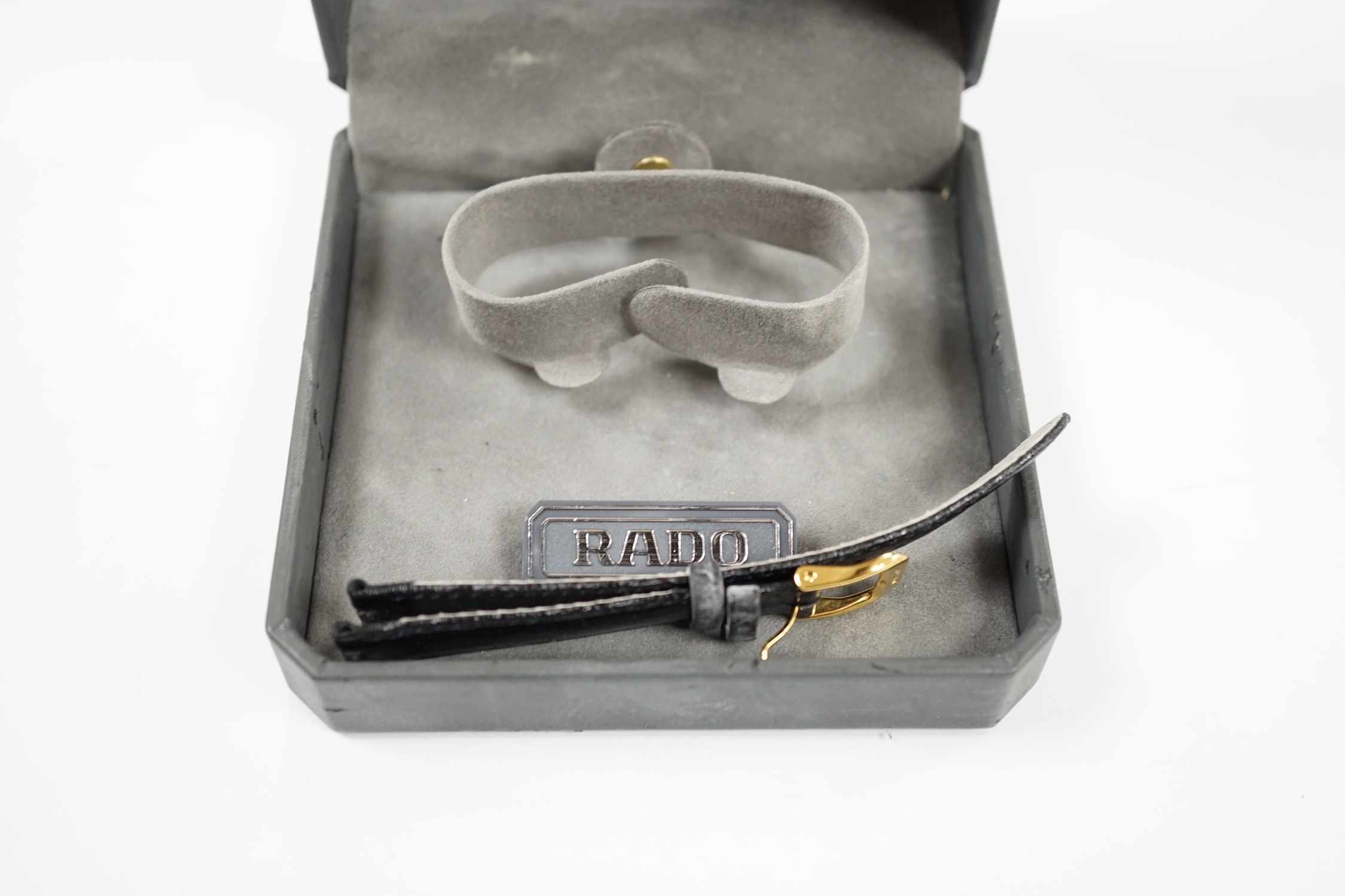 A lady's modern steel and gold plated Rado Jubilé quartz wrist watch, Rado strap and spare black Rado strap, with Rado box.